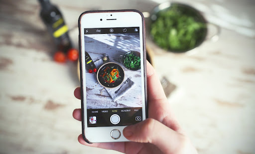 A restaurant app for mobile ordering taking a picture of food.