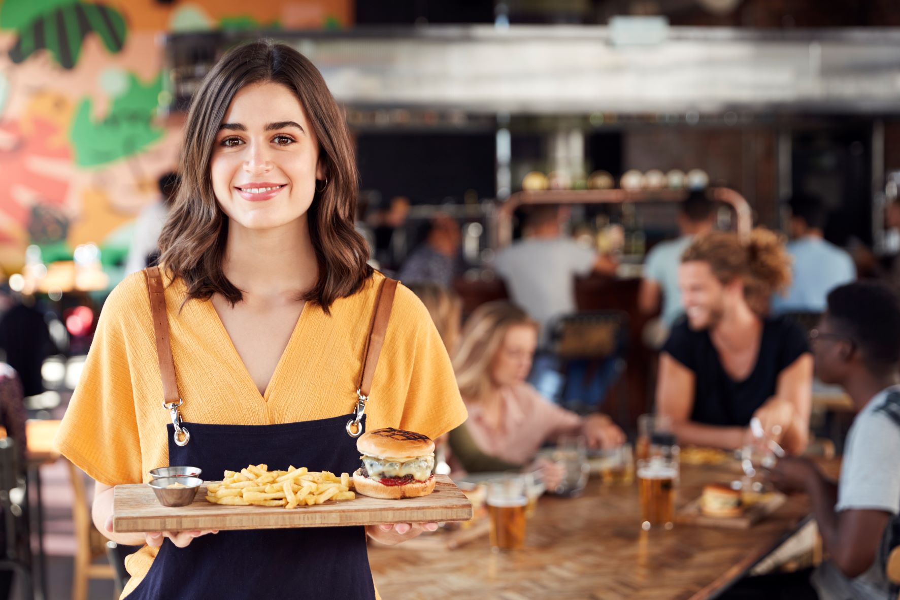portrait-of-waitress-serving-food-to-customers-in-2021-08-26-16-14-53-utc